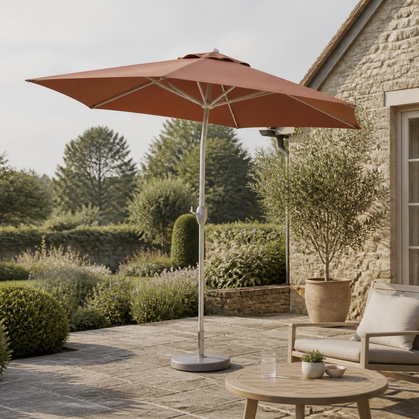 Corsham 3m garden parasol in terracotta, open on a stone patio